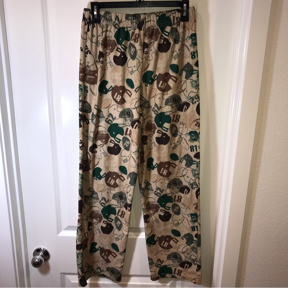 JC Penney’s fuzzy football pajama pants youth size L 14-16 allover print fleece